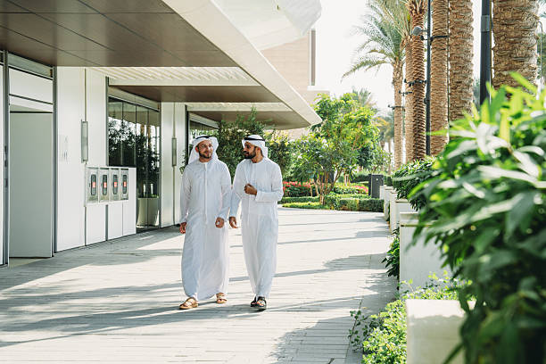 istock Arab businessmen walking and talking in Dubai 2208295015