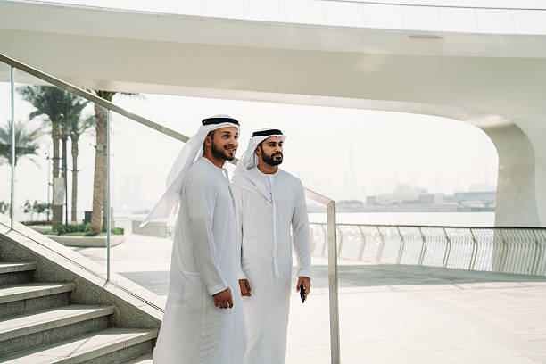 istock Emirati businessmen walking and talking in Dubai 2208295050