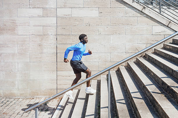 istock young sportsman running up steps outdoors in berlin 2208297964