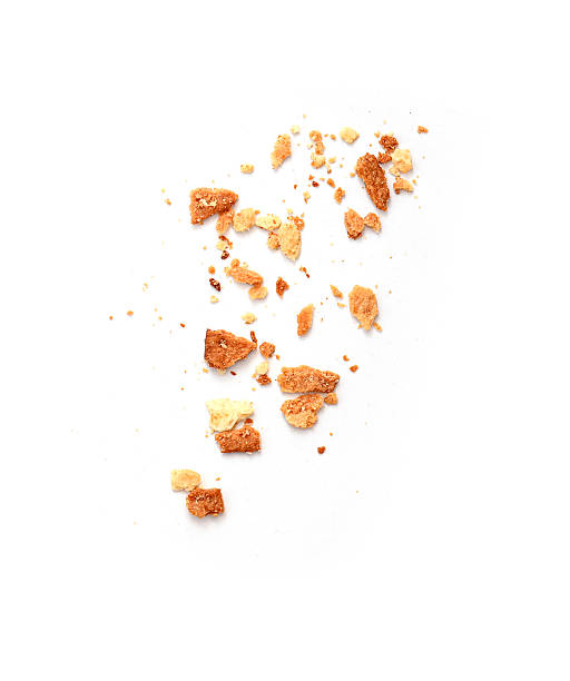 Heap of dry bread crumbs isolated on white
