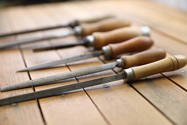 istock Vintage Metal Files with Wooden Handles on a Rustic Workbench 2208298220
