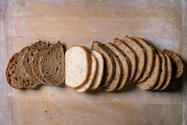 istock Variety of Sliced Bread on Board 2208299395