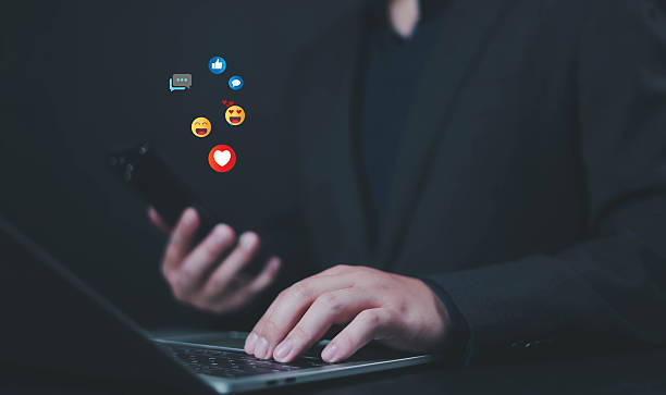 istock Social media and digital online, man using smart phone use social media network application, Friend reply chat concept or send emoticon for react feeling, playing Social media Distancing. 2208301512