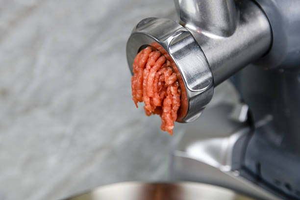 Making ground meat in modern food processor with meat grinder