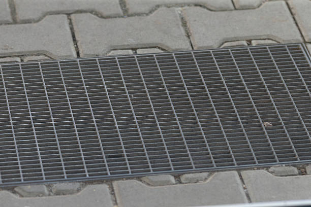 istock Metal Grate Sidewalk Mat featuring a textured Paver Background for durability 2208303651