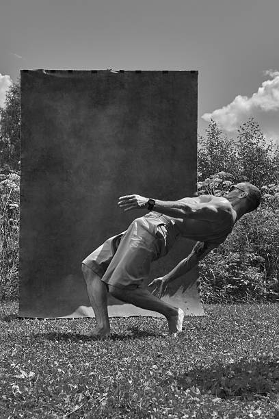 istock Male break dancer against nature and studio background. 2208306907