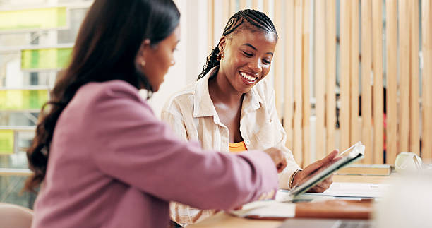 istock Education, teamwork and women with tablet, classroom and studying for exam with info, reading and online. Learning, collaboration and people in college with tech, research or smile for knowledge 2208314542