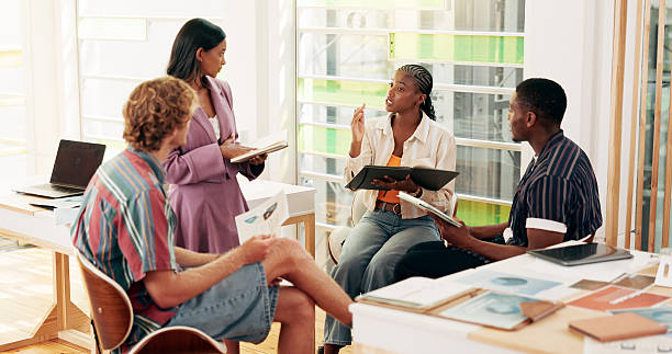 istock College, people and talking for education in class with group study, help and prepare for presentation. Students, planning and discussion with learning advice, sharing knowledge and university course 2208314598