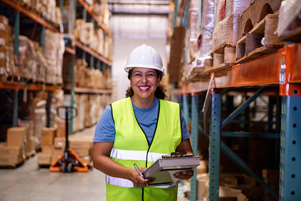 istock Happy Latina Warehouse Worker Using Clipboard in Inventory 2208318632