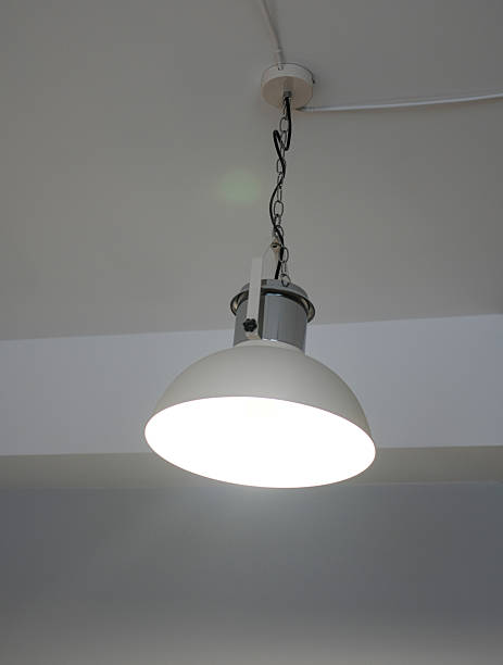 istock a lamp in a metal shade hangs on the ceiling, space for text 2208320706