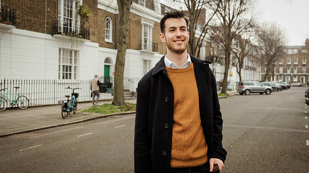 istock Stylish Young Man Using Smartphone – Modern Fashion & Digital Lifestyle 2208320774