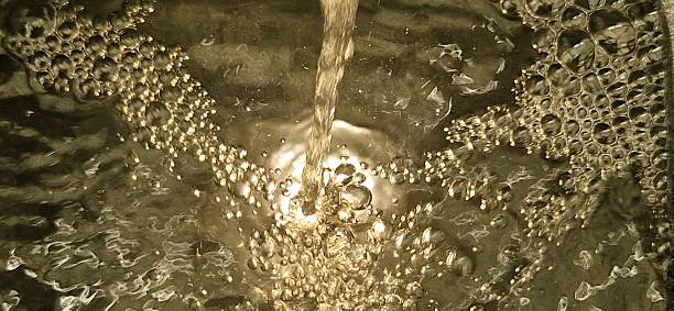 Close up of water in fountain with bubbles and spotlight