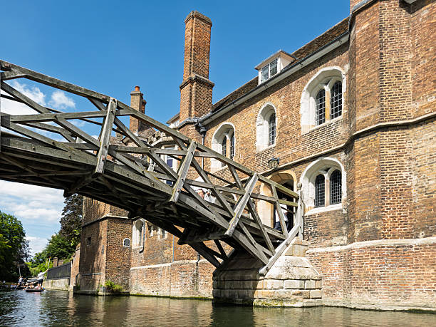 Bridge of Sighs and punting boat at Cambridge, St. John's College, University of Cambridge in a sunny day, England, United Kingdom