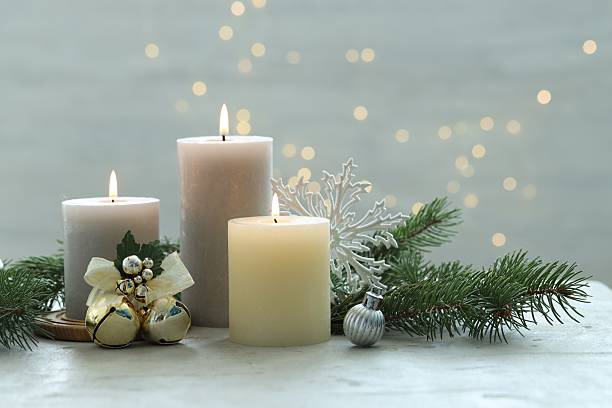 istock Burning candles, baubles and fir tree branches on white textured table, closeup 2208326238