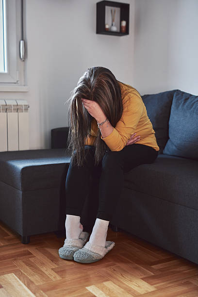 istock Woman with strong stomach ache, menstrual and digestive issues at home. 2208327763