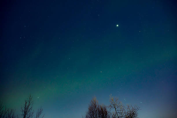 istock Aurora borealis, polar lights with Milky Way stars. 2208327841
