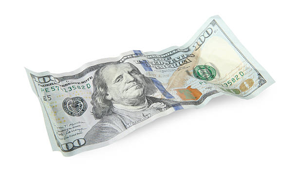 istock One crumpled dollar banknote isolated on white 2208328537