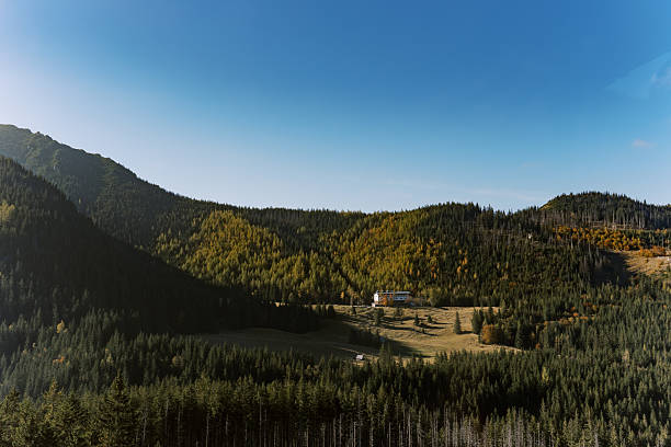 istock Mountain valley with a lonely house in autumn 2208330249