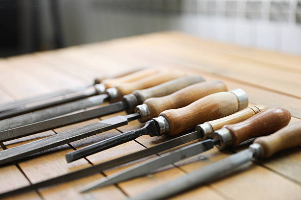 istock Vintage Metal Files with Wooden Handles on a Rustic Workbench 2208331068