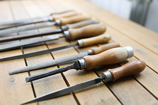 istock Vintage Metal Files with Wooden Handles on a Rustic Workbench 2208331259