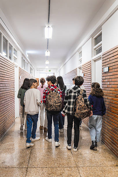 istock Students standing in line in school hallway 2208333355