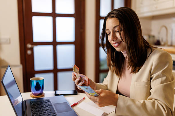 istock Young woman managing home finances 2208333938