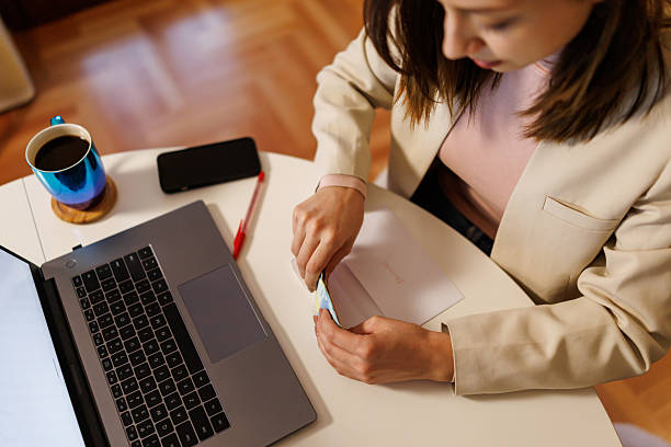istock Prudent young woman saving money 2208334078