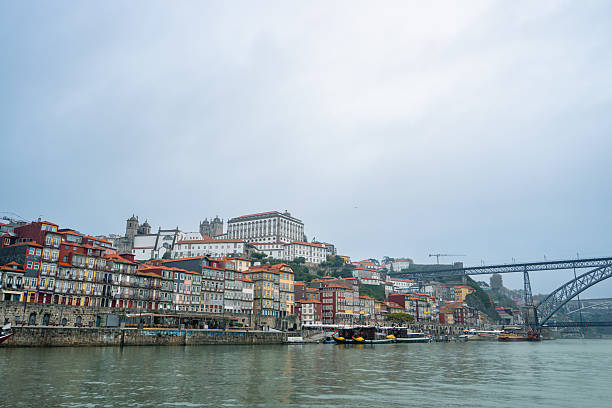 Scenic view of Dom Luis I Bridge from a Douro River cruise. See Porto and Vila Nova de Gaia's colorful riverside architecture.