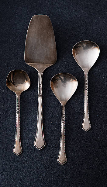 istock Elegant Silver Serving Utensils Set. Different spoons cutlery on a black background. 2208336068