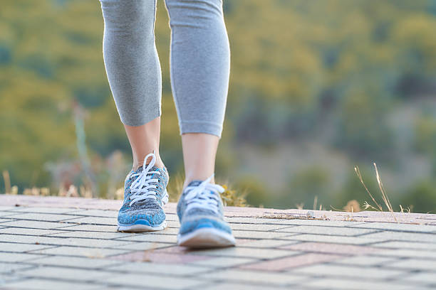 istock Walking on a paved path amidst a scenic landscape during early morning hours 2208338408