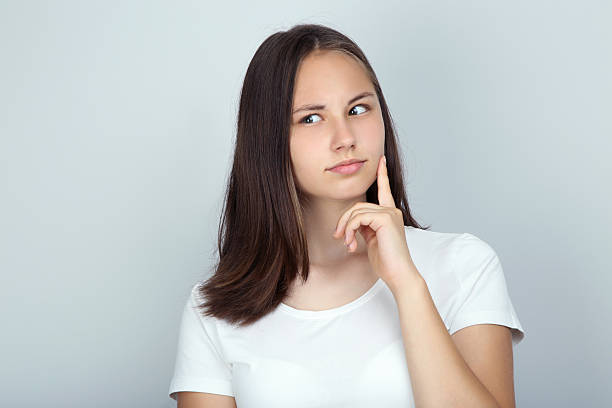 istock Young beautiful girl on grey background 2208341675