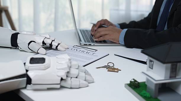 istock Futuristic robotic hand with contract and real estate model on desk 2208342807