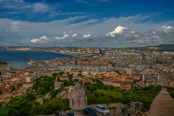 Stunning Aerial view on Marseille with  Old port (Vieux-Port) with small sailboats and motorboats.  From Notre-Dame de la Garde viewpoint , Behind Viewx-Portnew port for cruise ships)  and buildings of Mqrseille city
