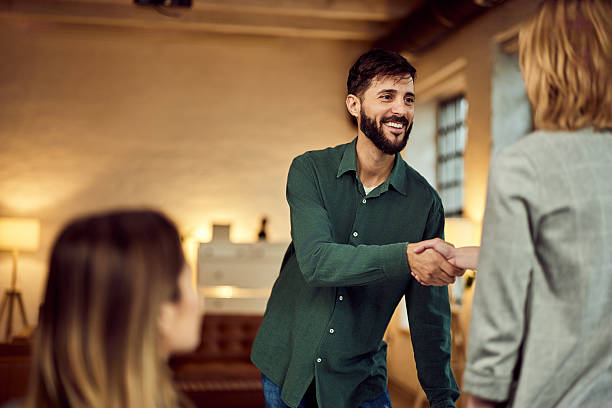 istock Friendly Business Meeting with Handshake in a Cozy Office Setting 2208343992