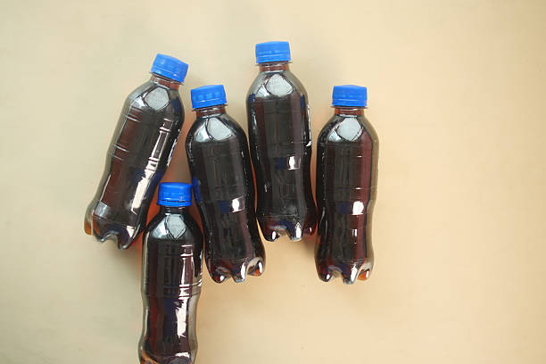 This is a delightful collection of five bottled drinks, each featuring vibrant blue caps