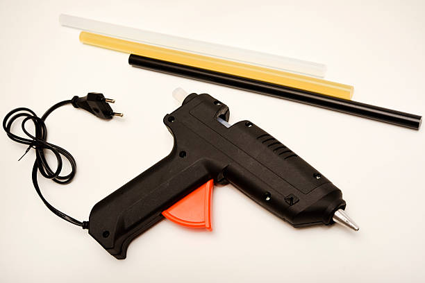 istock Black glue gun on a white background. 2208345116