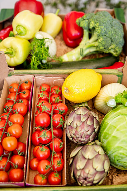 istock Vertical background of fresh farm grown vegetables . 2208348606
