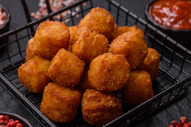 istock Cheese or potato croquettes, balls fried in breading with salt, spices 2208349507
