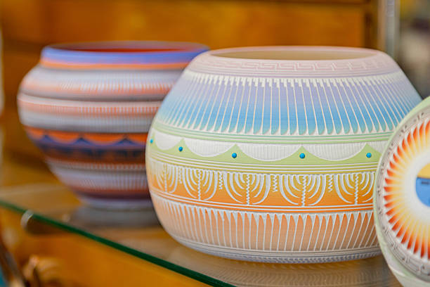 Navajo handmade ceramic bowl in souvenir shop display. Navajo Handmade Art Pottery Bowl. Traditional Native Navajo ceramic bowl handcrafted from red clay displays traditional patterns, close-up view.