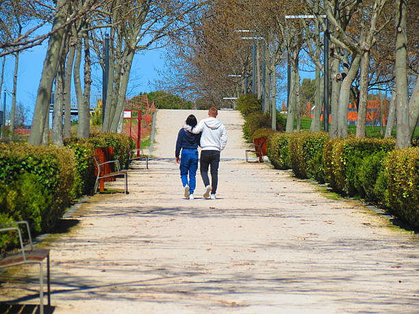 Madrid, Spain -03/30/2025  Public park .People walking in the park and enjoying a sunny day. Healthy lifestyle concept.