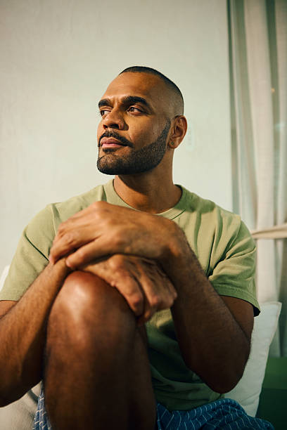 istock Young aboriginal australian man embracing wellbeing in the morning light 2208354237