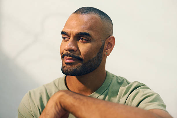 istock Young aboriginal australian man relaxing in the morning light 2208354284