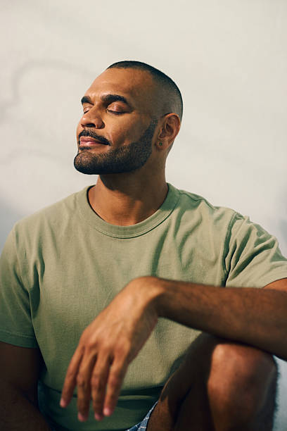 Young aboriginal australian man relaxing in the morning light