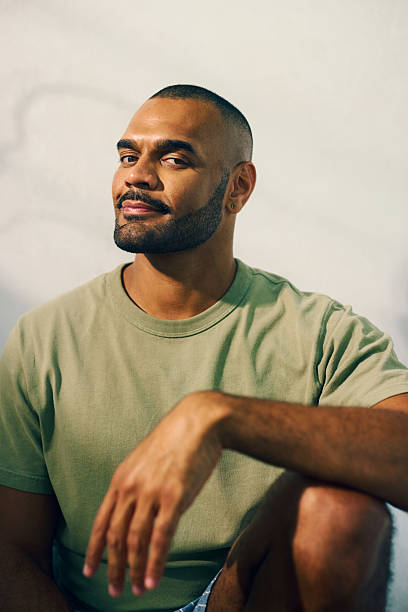 istock Young aboriginal australian man relaxing in the morning light 2208354300