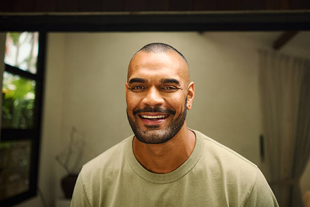 istock Young aboriginal australian man smiling at home in the morning 2208354326