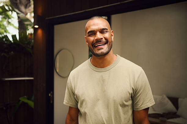 istock Young aboriginal australian man smiling at home in the morning 2208354329