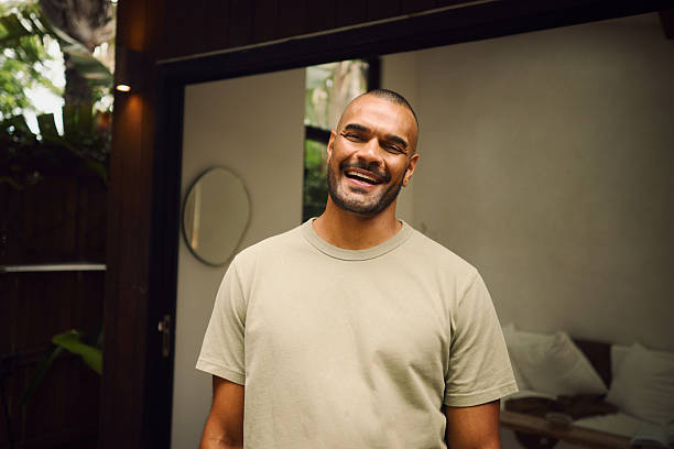 Young aboriginal australian man smiling at home in the morning