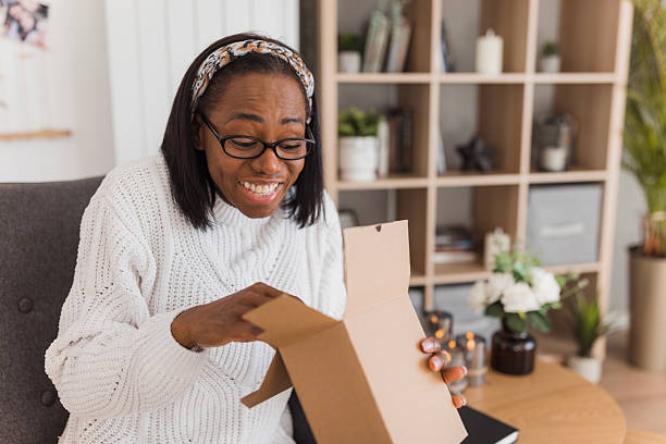 istock Woman loving the present she got 2208356385