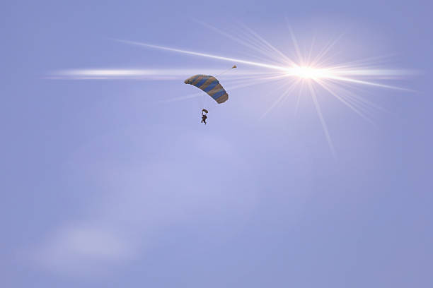Parachutist in the blue sky
