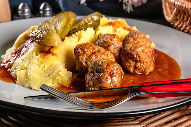 istock Meatballs pork and mashed potatoes topped with paprika gravy. 2208357723